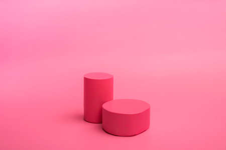 Valentines day background with podiums for products or cosmetics with hearts on a pink background. close up.の写真素材