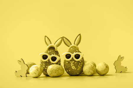 Colorful Easter egg with bunny ears and sunglasses on a blue background. Sale banner, mockup template. With copy spaceの写真素材