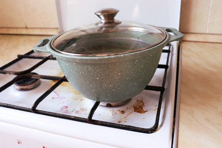 The pot is on a dirty gas stoveの写真素材