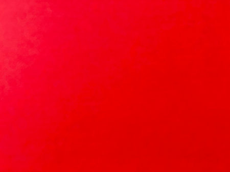 Paper textured background. The color of the paper is red. Place for textの写真素材