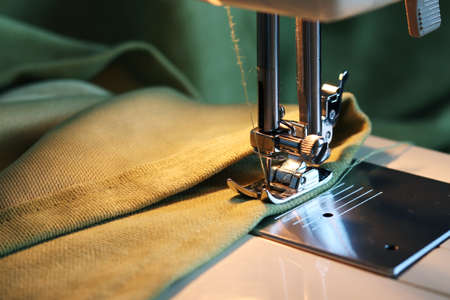 Sewing machine with fabric and thread close-up. Fabric processing on a sewing machine