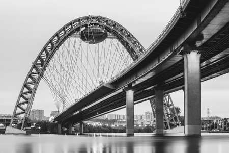 Scenic view of Zhivopisny Bridge in Moscow, Russian Federation. Photoshoot of the arch, a steel cable-stayed bridge over the Moskva River. Black and white photoの写真素材