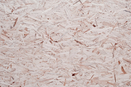 A panel of pressed wood chips. Textural background.の写真素材