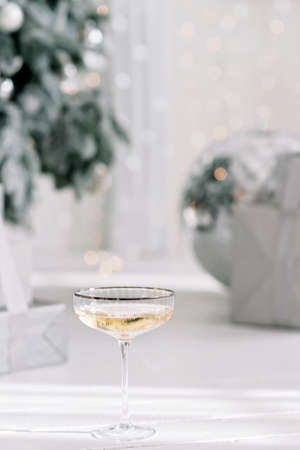 Happy New Year 2021. Christmas and New Year holidays minimal background, winter season. A glass of...
