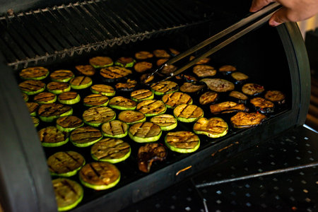 Vegetables eggplant and zucchini on the grill outdoors. Vegetarianism, healthy eating, food. Soft selective focus.の写真素材