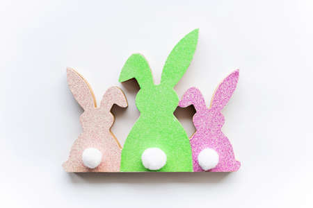 Cute Easter colorful bunnies on a white background. Happy Easter minimal concept, greeting card....