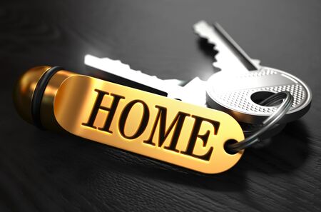 Keys with Word Home on Golden Label over Black Wooden Background. Closeup View, Selective Focus, 3D Render.の写真素材