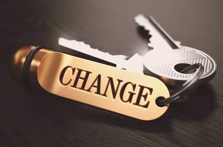 Change Concept. Keys with Golden Keyring on Black Wooden Table. Closeup View, Selective Focus, 3D Render. Toned Image.の写真素材