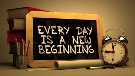 Inspirational Quote - Every Day is a New Beginning on Chalkboard. Blurred Background. Toned Image.の写真素材