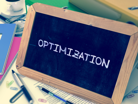 Optimization Handwritten by White Chalk on a Blackboard. Composition with Small Chalkboard on...