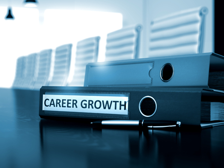 Career Growth. Concept on Toned Background. Career Growth - Office Binder on Wooden Table. Career Growth - Business Illustration. 3D Render.の写真素材