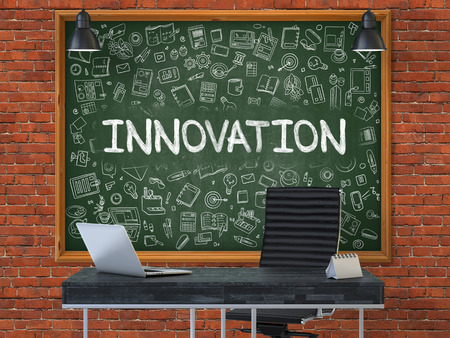 Innovation Concept Handwritten on Green Chalkboard with Doodle Icons. Office Interior with Modern Workplace. Red Brick Wall Background. 3D.の写真素材