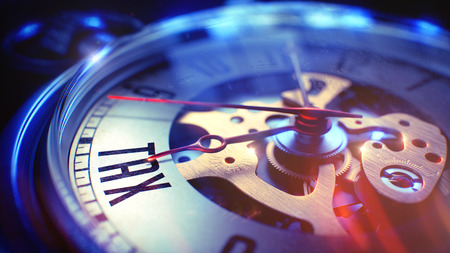 Watch Face with Tax Text on it. Business Concept with Light Leaks Effect. Tax. on Pocket Watch Face with Close View of Watch Mechanism. Time Concept. Lens Flare Effect. 3D Render.の写真素材