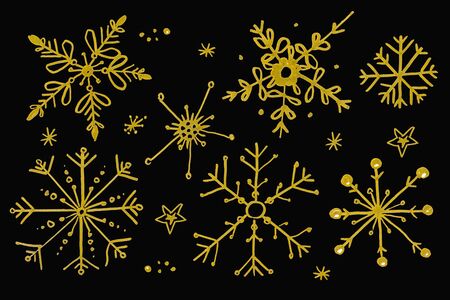 Set of gold watercolor snowflakes isolated on black background. Christmas winter holiday symbol in a doodle style. Elements for background, texture, card, design, etc.の写真素材