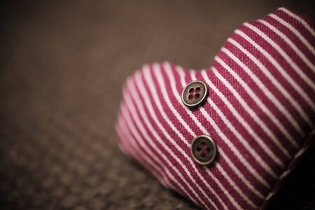 textile striped heart with buttonsの写真素材