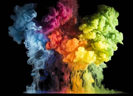 Colorful paint drops from above mixing in water. Ink swirling underwater
