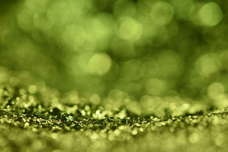 Green glitter lights texture. Abstract christmas background.の写真素材