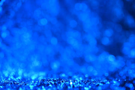 Blue glitter lights texture. Christmas abstract background.の写真素材