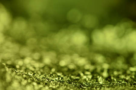 Green glitter lights texture. Abstract christmas background.の写真素材