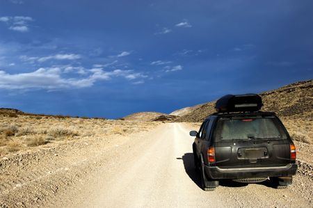 4x4 SUV on unpaved desert road in Death Valley National park California