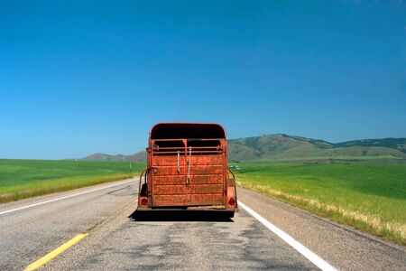 Antique pick up truck on empty Montana roadの写真素材
