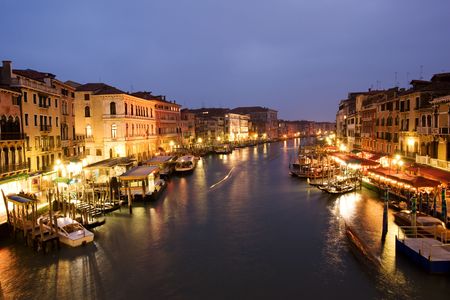 Night life along Venetian Grand Canal by Rialto bridgeの写真素材