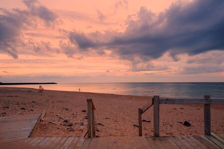 Sunset over beach in Inverness, Cape Breton, Nova Scotiaの写真素材