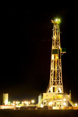 Oil derrick at night on Oklahoma plainsの写真素材