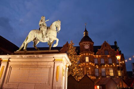 Illuminated town hall and Jan Wellem statue in old district of Dusseldorf の写真素材