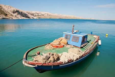Fishing boat in the crystal Adriatic water, Croatiaの写真素材