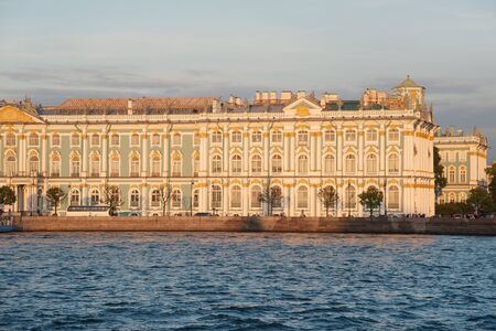 Iconic facade of Winter Palace with Neva river, Saint Petersburgのeditorial素材