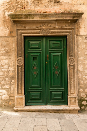 Beautiful old green wooden in historic Sibenik, Croatiaの写真素材