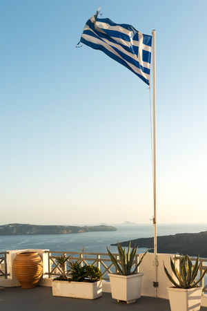 Greek flag raised at Santorini island in Cycladesの写真素材