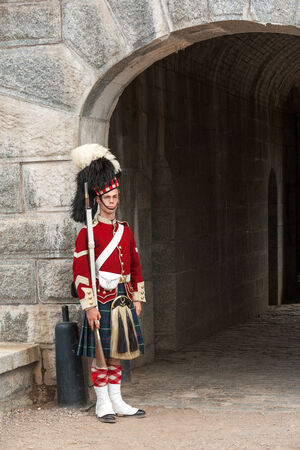 Halifax, Canada - August 24th, 2010 Guard standing by the gates of Halifax Citadel on August 24, 2008. Guard in historic uniform at Citadel National historic site in Halifax, Canada.のeditorial素材