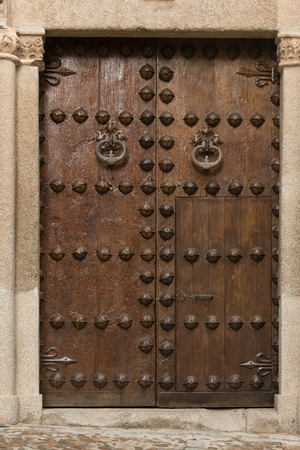 Ancient forged door of historic Toledo house Spainの写真素材