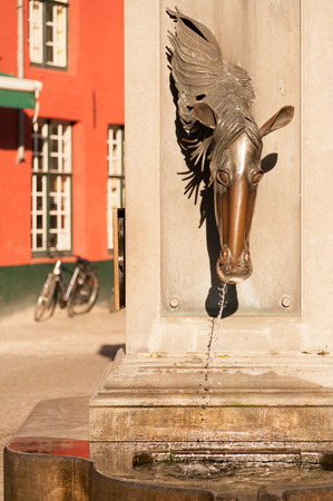 Drinking fountain for horses in historic center of Bruges, Belgiumの写真素材