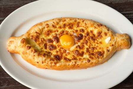 Khachapuri, traditional Georgian cheese-filled bread Ajarian styleの写真素材