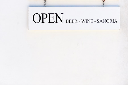 Open sign in the bar in Florida serving wine and sangriaの写真素材