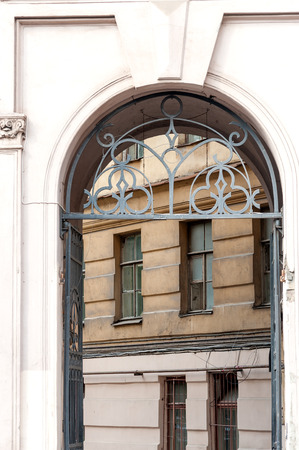 Arch entrance to typical residential courtyard in Saint Petersburg downtown, Russiaの写真素材