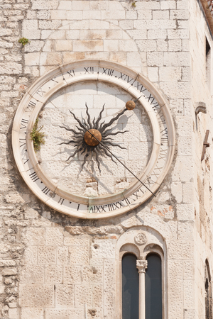 Clock tower of old stone church inside Diocletian City in Split, Croatiaの写真素材