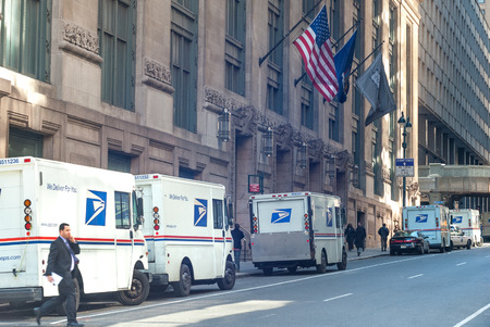 USPS delivery trucks lined up by James A. Farley Post Office landmark building on March 25, 2008 in Midtown Manhattan, New York City, USAのeditorial素材