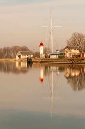 Lighthouse in old port of Honfleur in Normandy region of Franceの写真素材