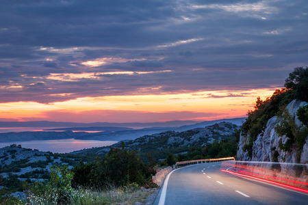 Traveling in sunset on the mountain road, Dalmatian coast, Croatiaの写真素材