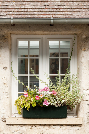 Cozy window of old house in Saint Guilhem le Desert village, Franceの写真素材
