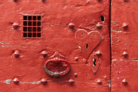 Close up of antique metal door with peephole in historic Plantagenet city, Le Mans, Franceの写真素材