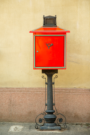 Bright red mailbox of Hungarian post  in Tokaj town center, Tokaj wine region, Hungaryの写真素材
