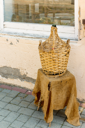 Wine bottle (carboy) by the shop  in Tokaj town center, Tokaj wine region, Hungaryの写真素材