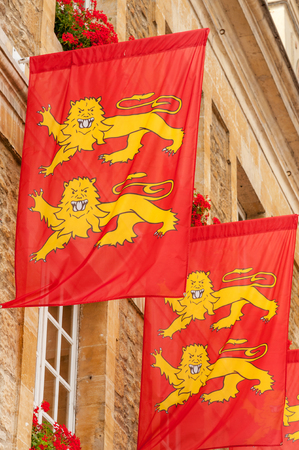 Facade of historical building in downtown Caen adorned with Norman flags, Normandy, Franceの写真素材