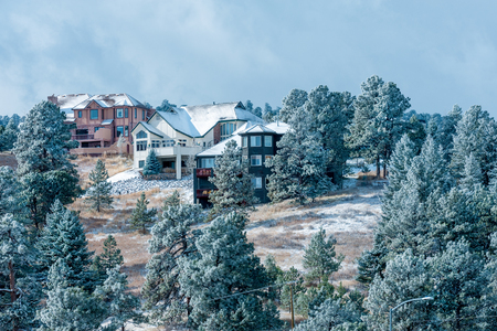 Large family homes in luxury development with snow spruce trees, Rocky Mountains, Colorado, USAの写真素材