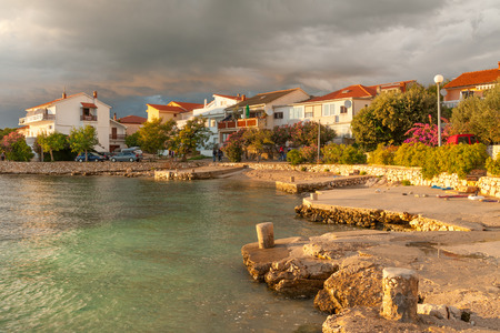 Sunset view of waterfront of quiet Mandre village on Pag island, Croatiaの写真素材
